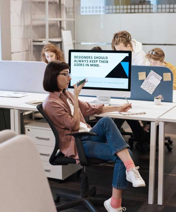 Team members collaborating at desks